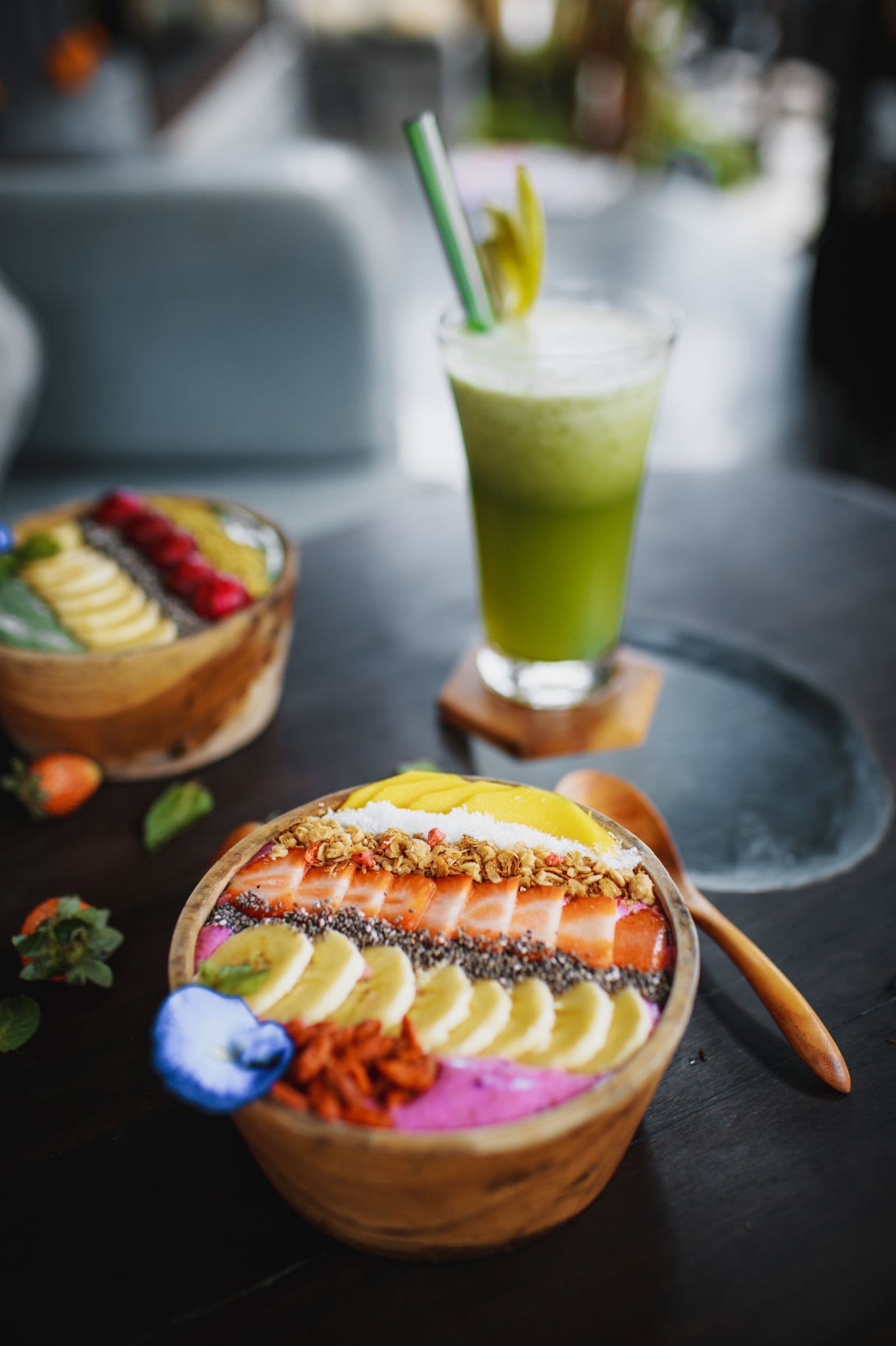 Fruit drink served in a glass beside a banana and a strawberry. Photo by ROMAN ODINTSOV (Pexels)